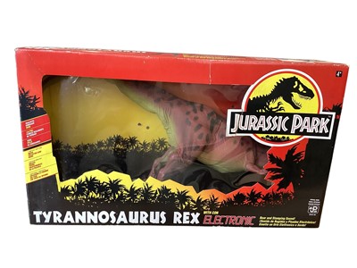 Lot 1928 - Kenner (c1993) Jurassic Park Tyrannosaurus Rex with reddish finish and electronic roar and stomping sounds (not tested), boxed (window lifted in places) (1)