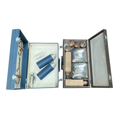 Lot 43 - 1950's / 60's Four person picnic set in brown and together with partial picnic in a blue case (2).