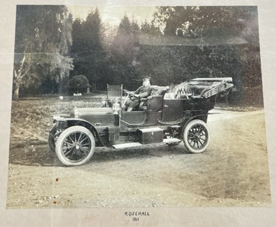 Lot 9 - Early motoring interest - large black and white photograph of an open tourer with chauffeur, mounted in a glazed frame captioned 'Rosehall 1911' 61.5 x 41cm