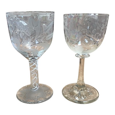 Lot 5088 - Antique wine goblet engraved with hops and barley and with an opaque spiral twist stem, together with a 19th century crystal wine goblet with foliage hand engraving including a Kukuburra (2)