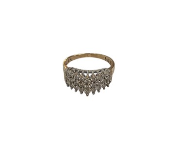 Lot 205 - Diamond three row ring with twenty seven brilliant cut diamonds estimated to weigh 0.50cts in total, in a high V shaped claw setting on 9ct yellow gold shank. Ring size K