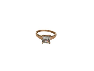 Lot 209 - 14ct rose gold square shaped synthetic white single stone ring in four claw setting, size M