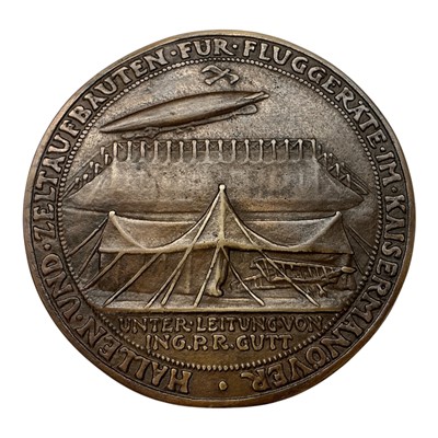 Lot 669 - Germany - A large bronze medallion commemorating The First use of Aircraft and Airships during The Imperial Manoeuvres 1911 by K. Goetz (Dia: 95mm) (1 medallion)