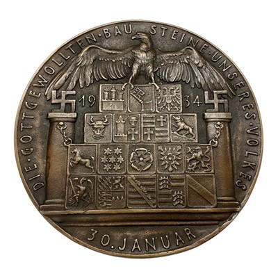 Lot 673 - Germany - A very large bronze medallion commemorating the First Anniversary of Hitler coming to power, Obv: Hitler facing left, 30 January 1934 by K. Goetz (Dia: 126mm) (1 medallion)