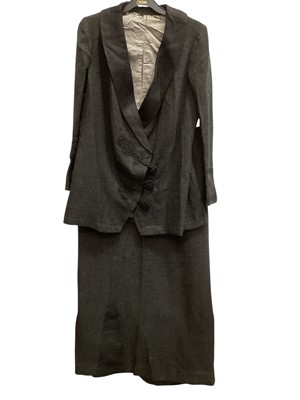 Lot 2595 - 1910 dark grey wool fitted coat with matching skirt and cord work fastenings. Provenance handwritten note attached ' Coat and skirt I wore when Gilly proposed to me "7th September 1910 E.G.
