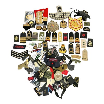 Lot 751 - Collection of assorted mainly Royal Navy and other cloth badges, cap tallies and other items, (1 box).