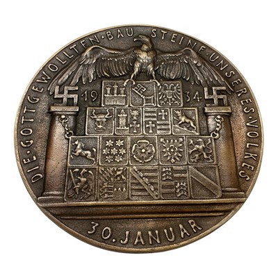 Lot 674 - Germany - A very large bronze medallion commemorating the First Anniversary of Hitler coming to power, Obv: Hitler facing left, 30 January 1934 by K. Goetz (Dia: 126mm) (1 medallion)