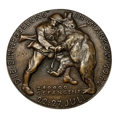 Lot 678 - Germany - A large bronze medallion commemorating The Encirclement of Kharkov, Obv: Portrait of Filed Marshall Fedor Von Bock facing right, Rev: A German soldier slaying a bear 22-27 July 1942 by...