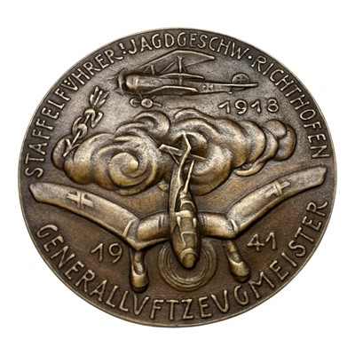 Lot 680 - Germany - A large bronze medallion commemorating The Death of German fighter ace Ernst Udet, Obv: Portrait of Ernst Udet facing right, Rev: A Stuka Airplane diving out of the clouds etc. 17 Nov...