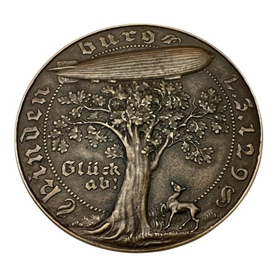 Lot 682 - Germany - A large bronze medallion commemorating The Maiden Flight to The Americas by Zepplin Hindenburg LZ 129, Obv: Depicts an owl sat on a compass with Anvil & Hammer beh...