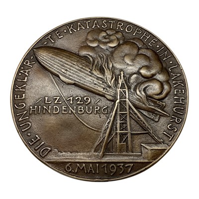 Lot 683 - Germany - A bronze medallion commemorating The Hindenburg Disaster Zepplin LZ 129, Obv: Portrait of Ernst A. Lehmann, Rev: Zepplin on fire, 6 May 1937 by K. Goetz (Dia: 93mm) (1 medallion)