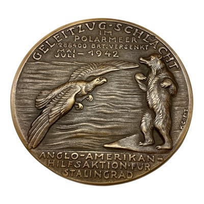 Lot 690 - Germany - A large bronze medallion commemorating The Battle of The Arctic, Obv: Sinking ships, aircraft & submarine, Rev: American eagle & Russian bear peering over a sea without ships Ma...