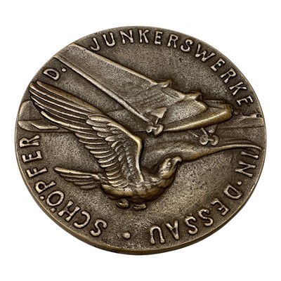Lot 693 - Germany - A bronze medallion commemorating The Death of Professor Hugo Junkers, aircraft engineer, Obv: Portrait, Rev: Airplane flying over a startled eagle looking upwards 1935 by K. Goetz...