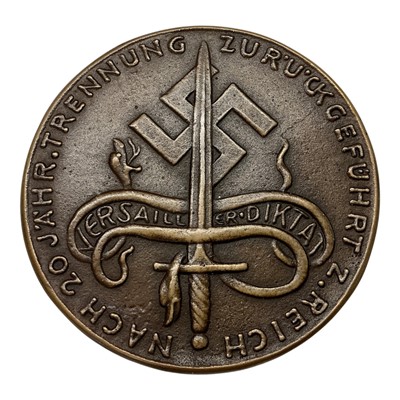 Lot 696 - Germany - A bronze satirical medallion commemorating The Reintegration of Belgium within The Borders of The Reich 18 May 1940 by K. Goetz (Dia: 71mm) (1 medallion)