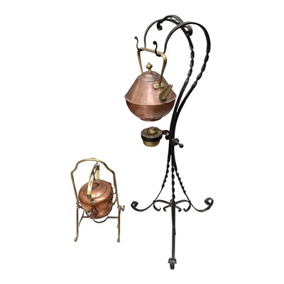 Lot 5182 - Arts and crafts copper and brass spirit kettle on iron tripod stand probably Benham and Froud after a design by Dr Christopher Dresser, registration number 51114 together with a similar copper a...