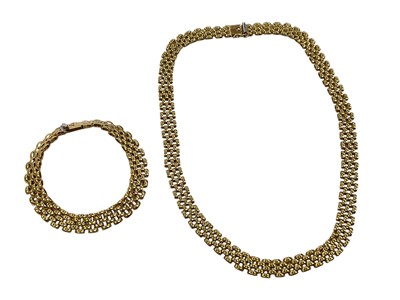 Lot 222 - Yellow metal brick-link chain necklace and a matching bracelet, both marked '18ct'