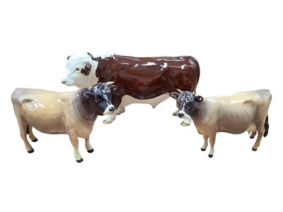 Lot 2264 - Beswick Jersey Bull - Ch. Dunsley Cow Boy, together with Jersey Cow - Ch Newton Tinkle and Beswick Hereford Bull - Champion of Champions (2)