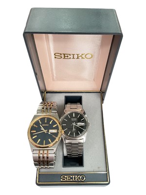 Lot 199 - Two Seiko stainless steel quartz wristwatches, within one box