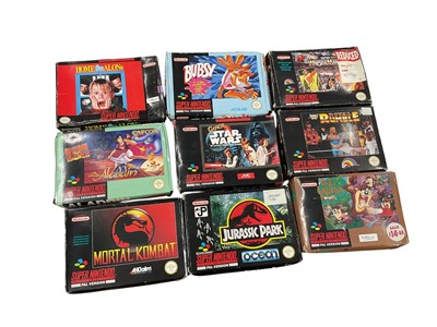 Lot 2715 - Collection of boxed Super Nintendo Games to include limited edition tin boxed Street Fighter 2, Home Alone, Bubsy, WWF Super Wrestlemania, WWF Royal Rumble, Super Star Wars.