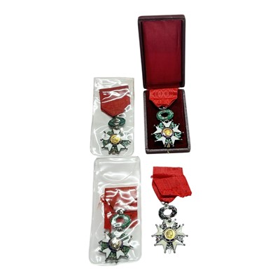 Lot 790 - Group of three French Legion d'Honneur medals, including one in box of issue together with a replica Legion d'Honneur (4).