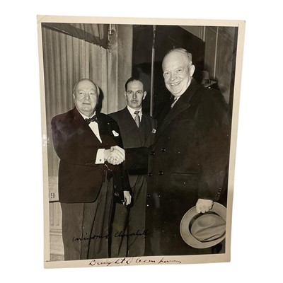 Lot 1156 - Historic photographs signed in pen by Winston Churchill and Dwight D. Eisenhower, the image capturing the two leaders together with Churchill's bodyguard Edmund 'Eddie' Murray. Provenance: By fa...
