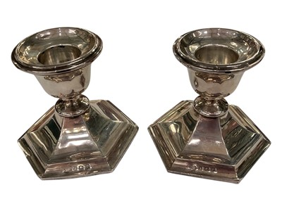 Lot 238 - Pair of small silver candlesticks with hexagonal weighted bases (Birmingham 1911), 7cm high