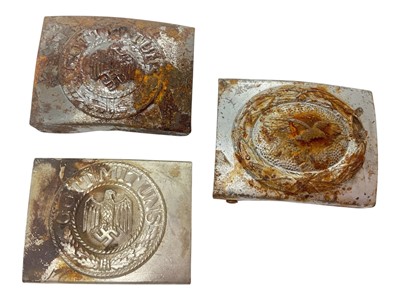 Lot 834 - Two Nazi German Wehrmacht belt buckles, together with a Luftwaffe belt buckle, (3).