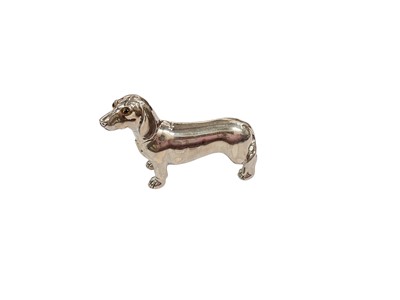 Lot 256 - Contemporary silver model of a Dachshund, stamped Sterling 925 to rear leg, 5cm in overall length.