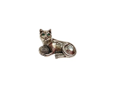 Lot 257 - Contemporary silver model of a seated cat with a ball of wool, stamped Sterling to base, 3.6cm in length.