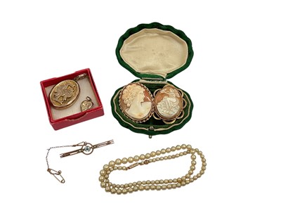 Lot 254 - Two cameos in 9ct gold brooch mounts, 9ct gold gem set bar brooch, simulated pearls with 9ct gold barrel clasp and two yellow metal / gilt metal lockets