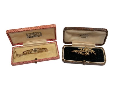 Lot 255 - Edwardian 15ct rose gold seed pearl brooch with grape and vine decoration, and one other 15ct gold floral spray brooch (2)