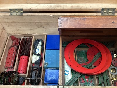Lot 1964 - Large wooden trunk with Meccano including motorwheels, gears etc. together with a constructed lorry