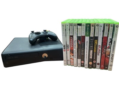 Lot 2792 - Black Xbox 360 console together with controller and games