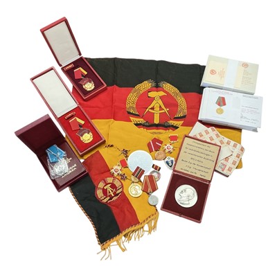 Lot 886 - Collection of Cold War era Eastern German and Soviet Militaria to include medals, flag, pennant and other items, (1 box).