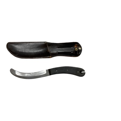 Lot 861 - Post Second World War Parachute release knife with curved steel blade, in leather sheath stamped Sheffield, England, blade approx. 15cm overall.