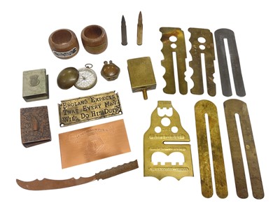 Lot 917 - Group of mixed militaria to include a napkin ring made from the teak of H.M.S. Warspite, another made from the timber of H.M.S. Cornwall, Trench Art lighter, brass button polishers and other ite...