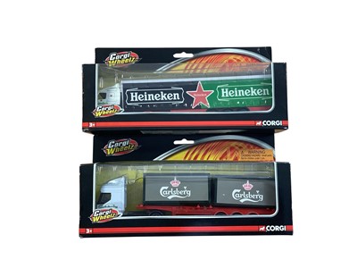 Lot Corgi Wheelz 1:64 scale diecast articulated lorries including ERF John Smith's curtainside, ERF Carlsberg skeletal trailer, Volvo Carling curtainside & Volvo Heineken curtainside, in window...