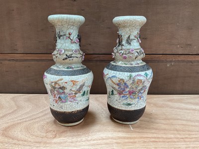 Lot 5020 - Pair of late 19th/early 20th century Chinese crackle glaze vases, decorated in enamels with figures on horseback, with applied prunus blossom, 24.5cm high