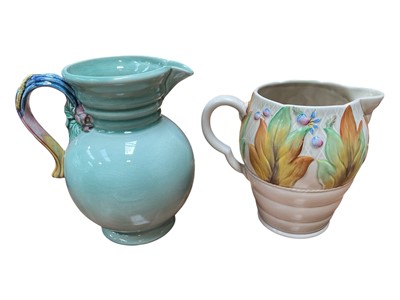 Lot 5021 - Two Clarice Cliff Newport Pottery jugs, 19cm and 22.5cm high