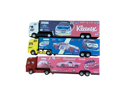 Lot Corgi 1:64 scale diecast articulated lorries including DAF Budweiser racing team trailer, DAF Kleenex Ford racing team trailer & DAF America Online racing team trailer (unboxed previously di...