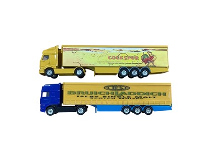 Lot Corgi 1:64 scale diecast articulated lorries including Renault Cockspur box trailer, DAF Bruich Laddich scotch whisky Curtainside, Volvo Johnnie Walker box trailer, Volvo Bowmore scotch whisky b...