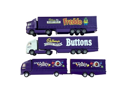Lot Corgi 1:64 scale diecast articulated lorries including Scania Cadbury's Freddo curtainside, Scania Caramel rigid truck, DAF Smarties curtainside, Volvo Cabury's Buttons curtainside, Volvo Cadbur...