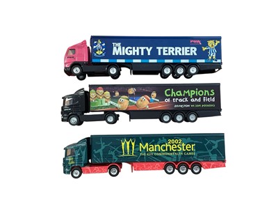 Lot Corgi 1:64 scale diecast articulated lorries including Scania 2002 Manchester XVII Commonwealth Games curtainside, Scania Branston Potatoes box trailer, Volvo The Pink Link The Mighty Terrier bo...