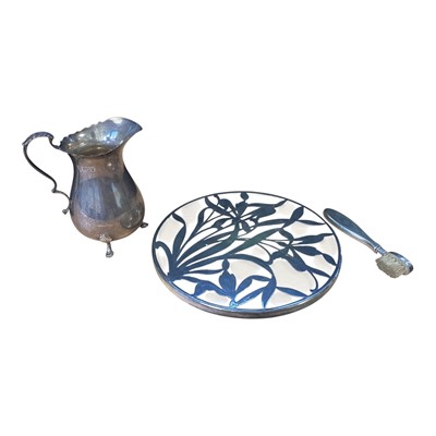 Lot 5167 - Silver milk jug and glass teapot stand with overlaid silver decoration