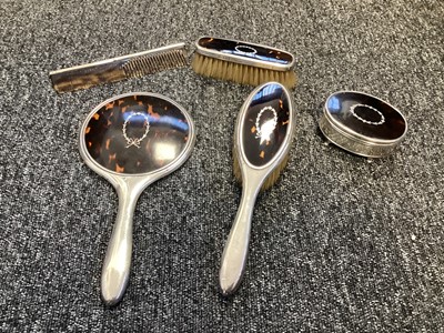 Lot 5185 - Silver and tortoiseshell five piece dressing table set, late 1920s/early 1930s, with inlaid wreath decoration