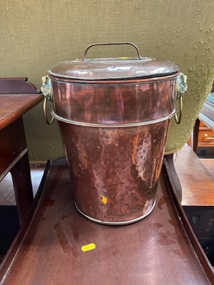 Lot 5178 - Victorian copper measure impressed with the number '2', with brass beast mask handles, 36cm high