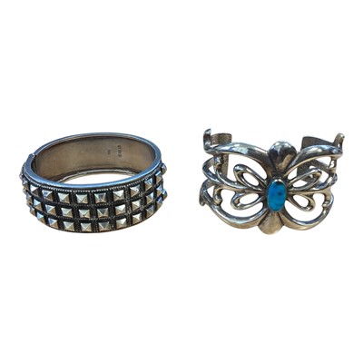 Lot 5183 - Contemporary silver studded bangle, and a Navajo white metal and turquoise bracelet (2)