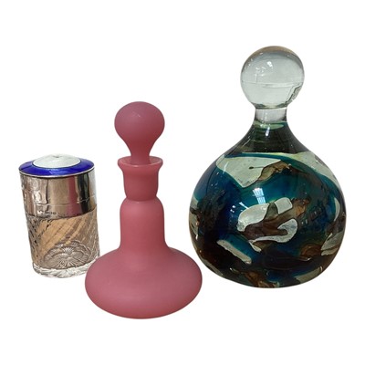Lot 5054 - Silver, guilloche enamel and cut glass scent bottle and stopper (Birmingham 1911), together with a Mdina glass bottle form paperweight and a pink glass scent bottle (3)