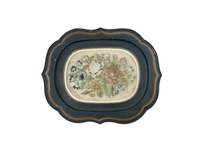 Lot 406 - 19th century toleware tray with inset glazed needlework panel, the embroidered needlework of various flowers and leaves.