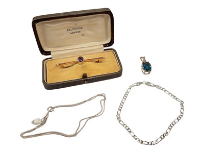Lot 917 - 9ct gold amethyst bar brooch in Selfridge London box, gem set pendant in 10k gold mount, silver flat curb link bracelet and a silver chain
